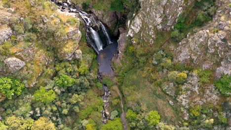 Aerial-High-Angle-View-Of-Fervenza-do-Toxa-Waterfalls-Cascading-Down-Rockface