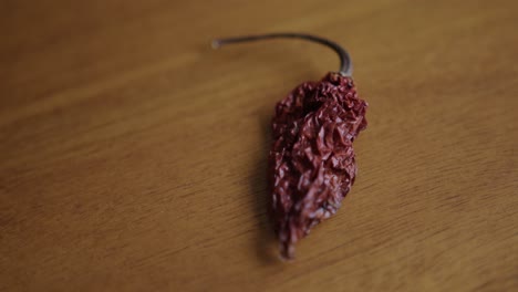 Close-Up-Pan-Right-of-a-Dried-Ghost-Pepper-on-a-Table