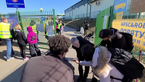 Poland---Ukraine-Customs-Border-Crossing-Interview-At-Bus-Station-With-Refugees