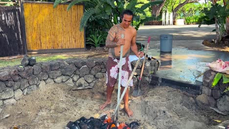 Preparing-the-pit-and-heating-stones-to-slow-roast-and-smoke-a-Kalua-pig-for-a-traditional-Luau