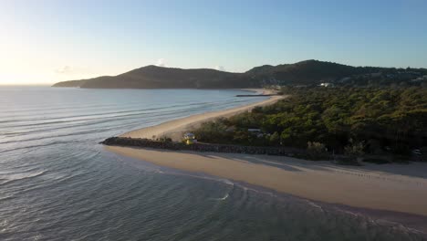 Noosa-Heads-sunrise-aerial-with-beach,-river-mouth,-waves