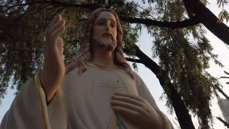 A-stabilized-shot-of-an-old-french-colonial-statue-of-Jesus-Christ-at-the-Thu-Thiem-Church-in-district-2-of-Ho-Chi-Minh-City-aka-Saigon,-Vietnam