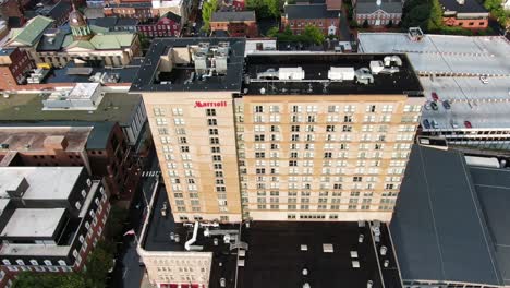 Tilt-down-aerial-view-of-Marriott-Hotel-and-Convention-Center-in-summer-magic-hour-light