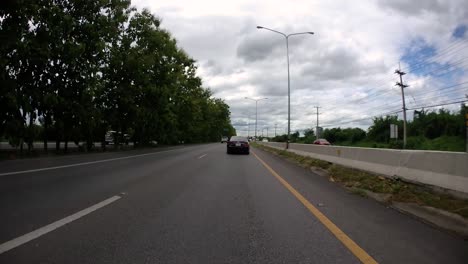 This-is-a-time-lapse-with-an-action-camera-mounted-in-front-of-the-truck,-driving-from-Pranburi-to-Hua-Hin-and-Hua-Hin-to-Bangkok-on-Phet-Kasem-Road