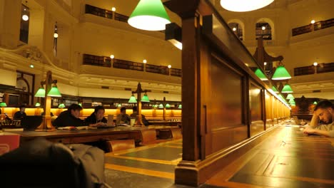 State-Library-Victoria-at-nighttime-people-studying-at-melbourne-library-Melbourne-tourism-attractions,-melbourne-library