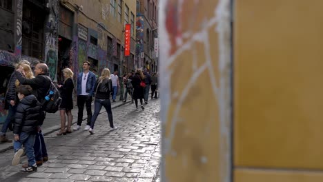 Tourists-visiting-graffiti-artwork-in-Hosier-Lane-Melbourne-CBD