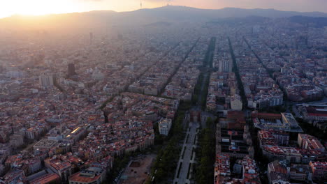 Barcelona-cityscape-aerial-view-at-sunset-with-clouds,-Spain