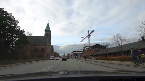 POV-Driving-view-car-through-cloudy-weather-in-central-area-in-Copenhagen,-Denmark