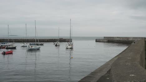 Yachts-and-small-boats-in-the-early-morning-at-Bray-Harbour,-Ireland