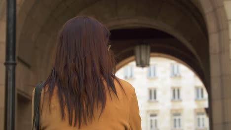 Young-confident-girl-walking-in-the-city-centre