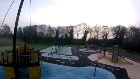 Recreational-colourful-children's-spooky-empty-playground-FPV-slow-motion-flying-aerial-view