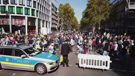 Pan-with-a-long-row-of-protesters-on-a-Fridays-for-Future-march-agains-climate-change-and-for-political-action-to-halt-global-warming