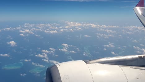 Fly-over-atolls-of-Maldives-top-aerial-view-from-airplane