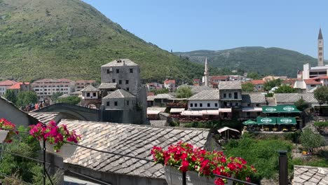 Rooftops-of-Mostar,-Old-bridge-in-distance