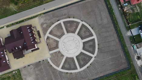 Birds-eye-View-of-Facility-in-the-Countryside-With-a-Circular-Shaped-Monument-Yard