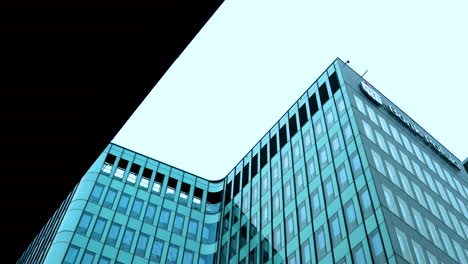 Polish-Bank-Tall-glass-buildings,-glazed-office-buildings-reflect-the-sky-and-clouds-in-the-glass