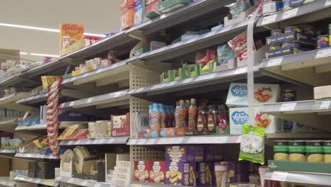 Restricted-supermarket-corona-virus-panic-buying-shoppers-store-shelves-consumerism