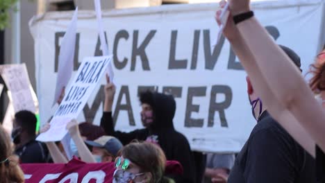 Fast-whip-pan-to-large-Black-Lives-Matter-banner-at-peaceful-march
