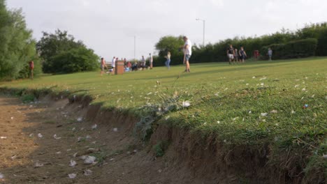 People-enjoying-warm-weather-in-park-wide-shot