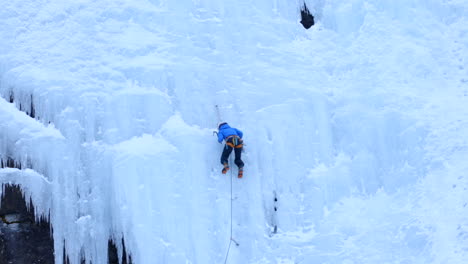 An-Ice-Climber-Scaling-a-Massive-Ice-Wall