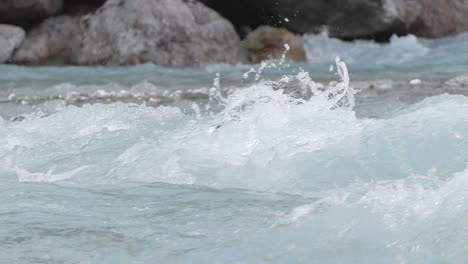 Detail-shot-in-slowmotion-of-the-water-in-the-Venosc-river,-showing-the-textures-of-the-water,-French-Alps