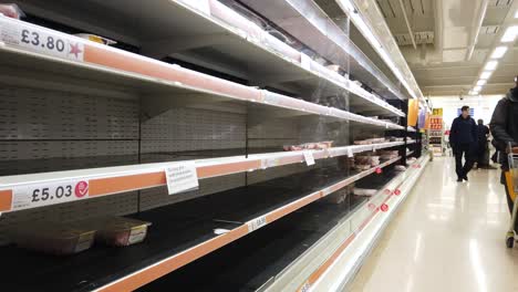 Panic-buying-and-stockpiling-in-supermarket,-Sainsbury's-in-the-UK,-occurring-as-a-result-of-the-Coronavirus-outbreak