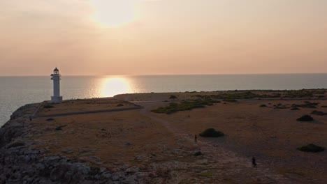 Dramatic-sunset-over-Far-de-Barbaria-on-Formentera,-Balearic-Islands,-Spain
