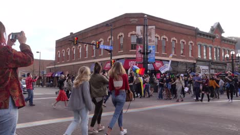 People-celebrating-Joe-Biden's-election-victory-in-the-streets-of-Boulder,-Colorado