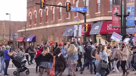 People-celebrating-Joe-Biden's-election-victory-in-the-streets-of-Boulder,-Colorado