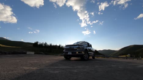 A-super-cinematic-and-smooth-pan-around-the-front-of-the-truck-with-lens-flare-using-a-drone