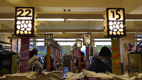 Customers-Buying-Groceries-at-Whole-Foods-Checkout-Aisle