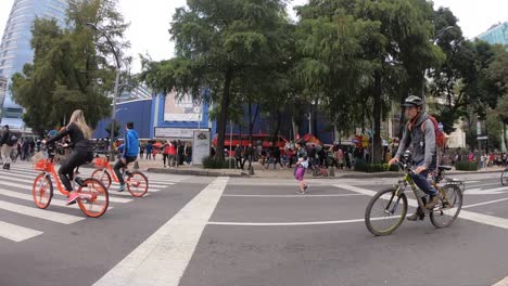 Slow-motion-shot-of-people-riding-their-bycicles-in-Mexico-City's-Reforma-Avenue