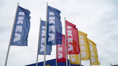 Ikea-Flags-Blowing-in-the-Wind-next-to-Blue-Storefront-on-Cloudy-Day