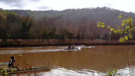 People-In-High-Kneeling-On-Canoe-Paddling-On-Ropotomo-River-During-Summer-In-Bulgaria