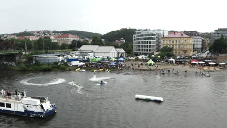 Aerial-Shot-Of-A-Jetsurf-Competition-On-The-Vltava-River-In-Prague,-People-Watching-The-Action