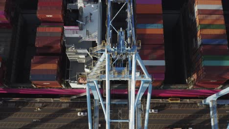 Bird's-Eye-View-Of-Cranes-And-Cargo-Containers-At-The-Husky-Terminal,-Tacoma-Port-In-Washington,-USA---drone-shot