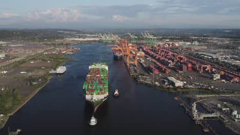 Container-Ship-At-Industrial-Port,-Husky-Terminal,-Port-Of-Tacoma,-Washington,-USA---aerial-drone-shot