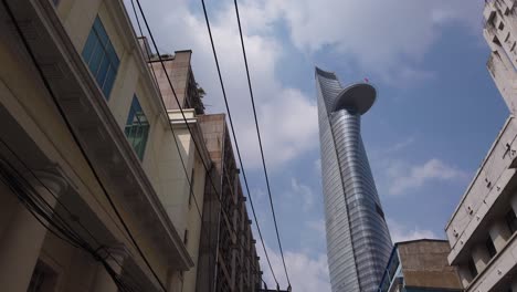 Stabilized-gimbal-shot-of-Modern-and-French-colonial-architecture-featuring-Bitexco-financial-tower-in-District-one-of-Saigon,-Ho-Chi-Minh-city,-Vietnam