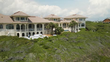 Wedding-venue-setup-at-beach-resort-Aerial-tracking-in