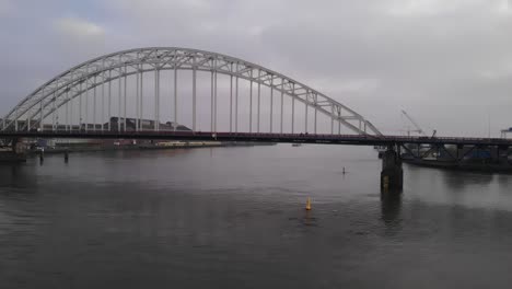 Scenic-View-Of-Suspension-Bridge-Over-Noord-River-In-The-Netherlands---wide-shot