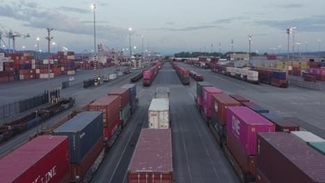 Fly-Over-Piles-Of-Storage-Containers-In-A-Shipyard-In-Washington---aerial-shot