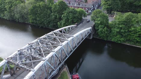 Aerial-view-rising-top-down-above-Manchester-ship-canal-swing-bridge-Warrington-England