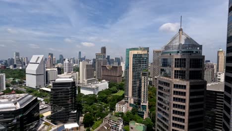 Afternoon-timelapse-of-clouds-passing-over-rooftops-of-skyscrapers-in-downtown-Bangkok,-Thailand