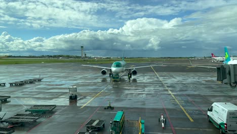 Wide-shot-of-Air-Lingus-airplane-rolling-to-takeoff-runway-during-cloudy-day-in-Ireland