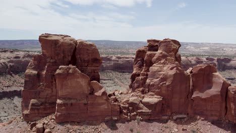 Aerial-Flight-through-Red-Rock-Sandstone-Cliffs-in-the-Southwest-Desert-near-Moab,-Utah