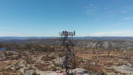 Observation-Deck-Towering-In-Norwegian-Nature-Landscape-With-Travelers-During-Summer