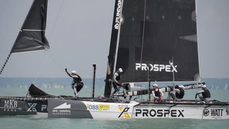 Prospex-Catamaran-racing-team-making-a-turn-at-Kék-Szalag-Grand-Prix,-Lake-Balaton---2021-Slow-Motion