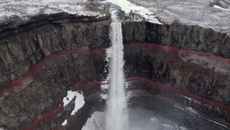 Aerial-flyover-of-famous-Hengifoss-Waterfall-in-Iceland