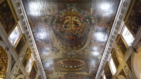 Church-of-Sao-Roque-painted-ceiling-of-the-nave-is-designed-to-give-the-illusion-of-barrel-vaulting-supported-by-four-large-arches-covered-in-volutes-and-other-decorative-elements