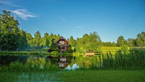 Day-to-Night-Timelapse-of-group-of-people-during-vacation-at-natural-lake-with-apartment-house-in-nature